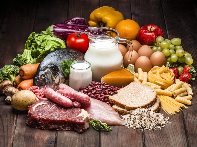 Different types of food on rustic wooden table