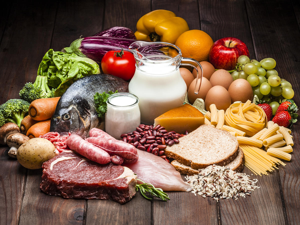 Different types of food on rustic wooden table