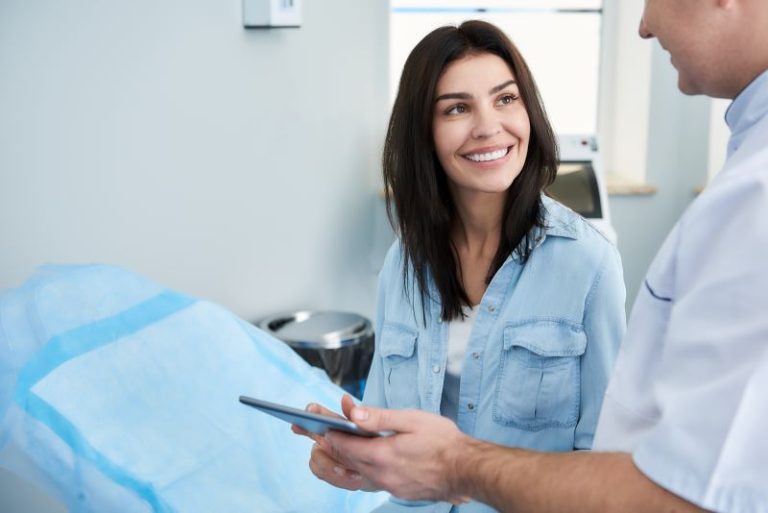 Patient-and-doctor-talking-during-plastic-surgery-consultation
